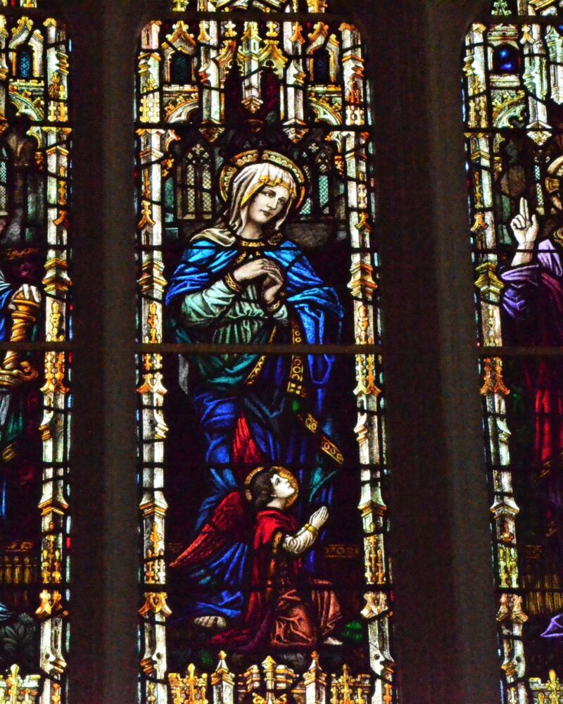 St. Paul, holding a book and sword;
Mary  and Christ.